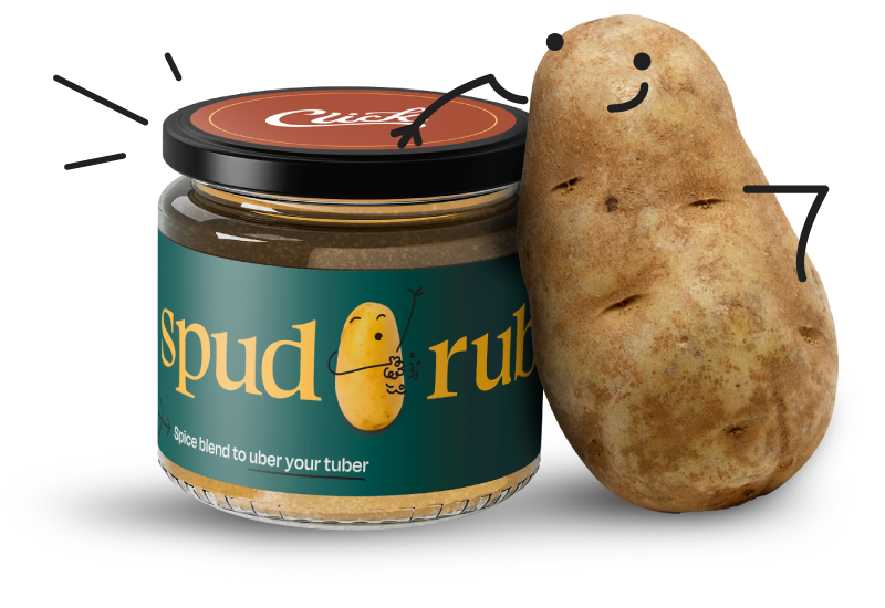 Potato leaning up against a jar of Spud Rub